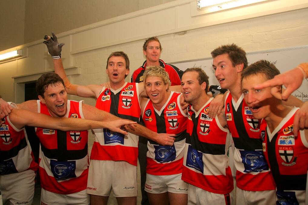 Myrtleford celebrates after scoring one of the biggest modern-day upsets against Albury in 2012. The Tigers had won three straight flags.
