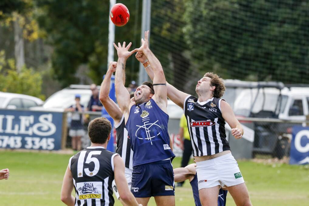FLYING HIGH: Yarrawonga's Brad O'Connor tries to mark the ball, despite the pressure from Wangaratta's defence. Yarrawonga won by 37 points.