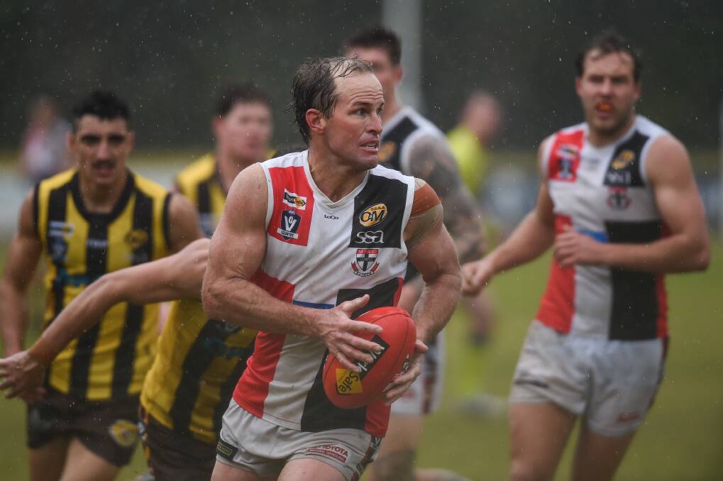 'MUZZA' MAGIC: Myrtleford veteran Brad Murray was superb in the wet weather, racking up 26 touches and directing play. Picture: MARK JESSER