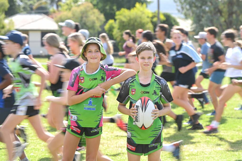 FLYING: Laycii Freund, 11, (left) and Lachlan Ratnik, 14, are part of the increase in numbers for Albury Thunder Junior Rugby League Club. Picture: MARK JESSER