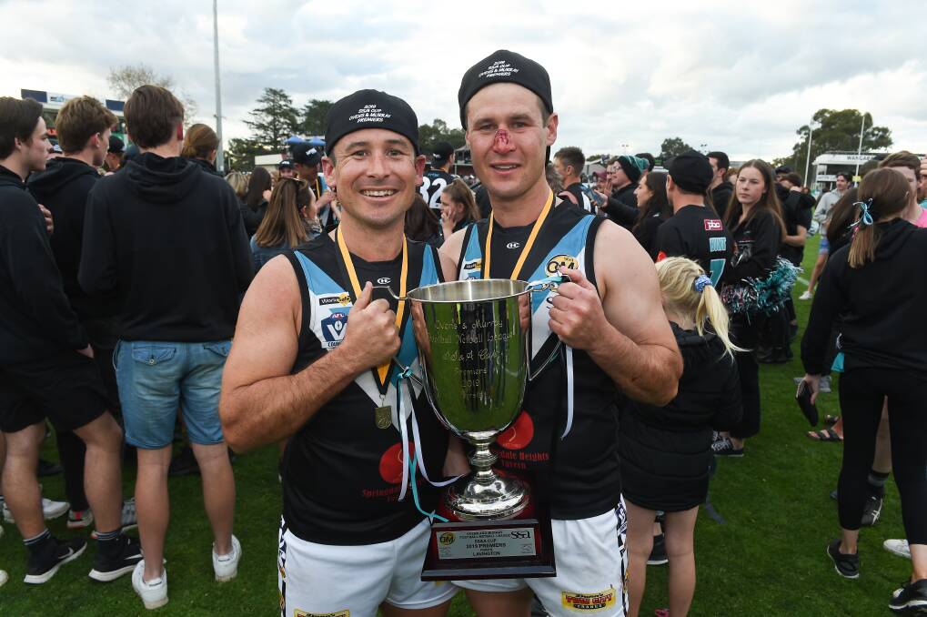 DOUBLE: Lavington's brothers Nick (left) and Kris Holman celebrate. Nick was one of only two players - joining Adam Butler - from the 2005 flag. Picture: MARK JESSER