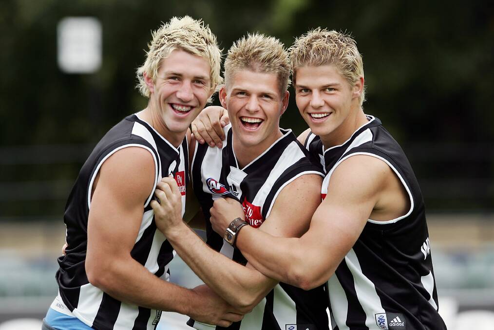 Siblings Travis, Jason and Cameron Cloke (right) at Collingwood in 2005.