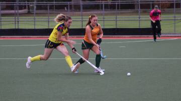 Spitfires' Rylee Pontt (right) races her opponent from UCHC to the ball. Picture by Hockey Albury Wodonga