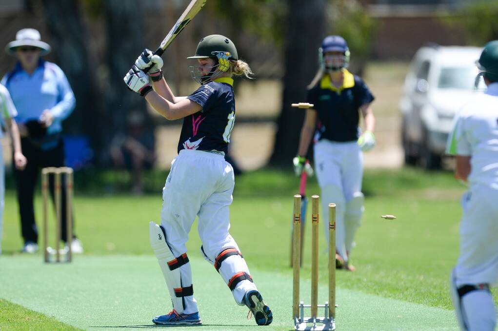 DEATH RATTLE: Wagga's Stacie Hiscock's hears what every batter dreads at Country Week. Cricket Albury-Wodonga proved too strong for the visitors at under 17 level. Pictures: MARK JESSER