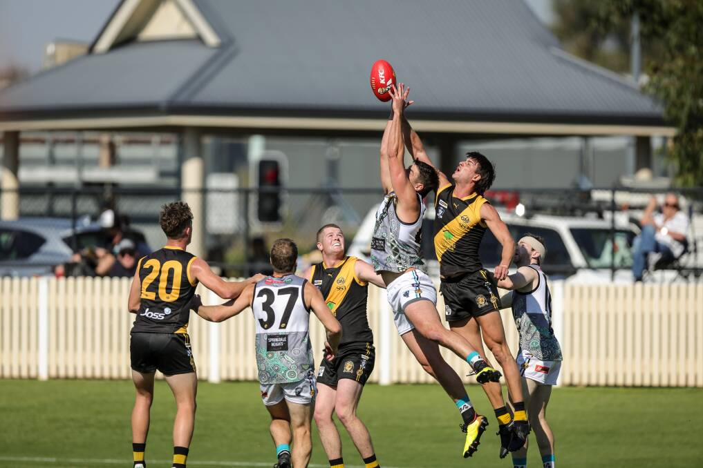Lavington full forward Tim Oosterhoff (front of marking contest) and Albury's Hamish Gilmore contest a mark, with the latter one of the Tigers' few winners. Picture by James Wiltshire