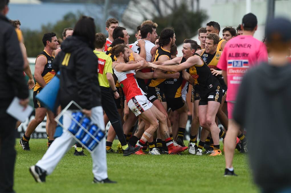 MELEE: Albury and Myrtleford players came to grips just on
three-quarter time on Sunday. It took some time for the
teams to separate. Picture: MARK JESSER