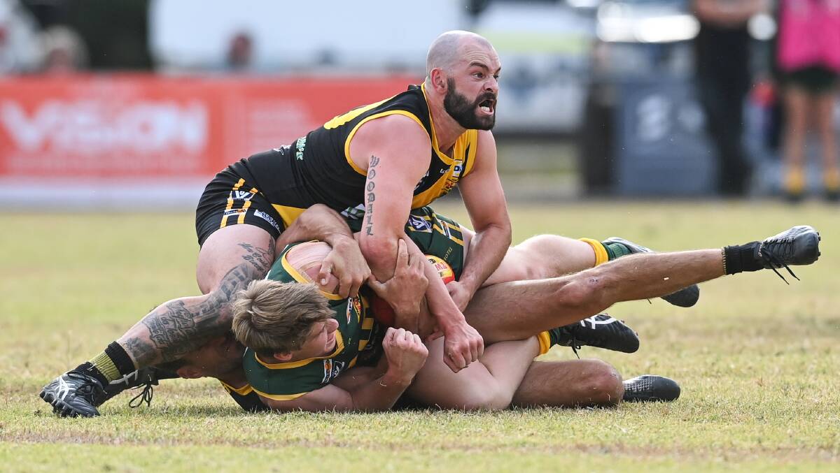 WRAPPED-UP: Barnawartha midfielder Jarrod Woodall.appeals to the umpire for a holding the ball decision. Picture: MARK JESSER