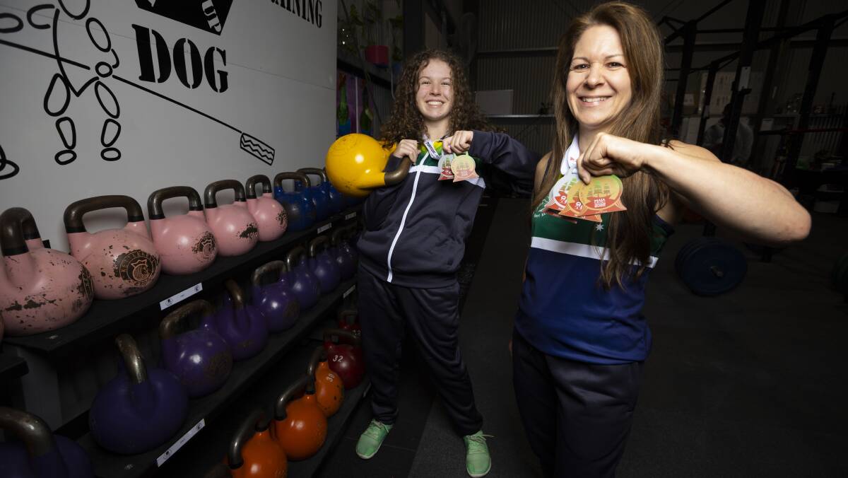 WINNERS ARE GRINNERS: Hope and Lisa Chater recently returned from the World Kettlebell Championships in Portugal with a swag of medals. Picture: ASH SMITH