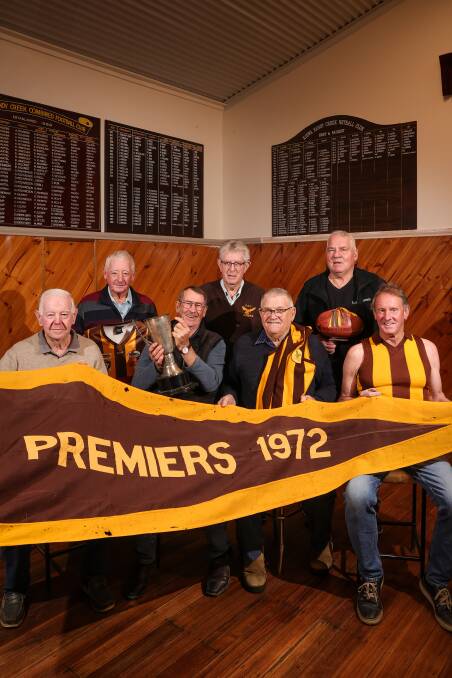 PREMIERS: Premiership team-mates Ray Rolfe, Ken Coulston, Bob Whitehead, Terry Barber, David Sutherland, Paul Lonergan and Vin O'Neill with the spoils of victory. Picture: JAMES WILTSHIRE
