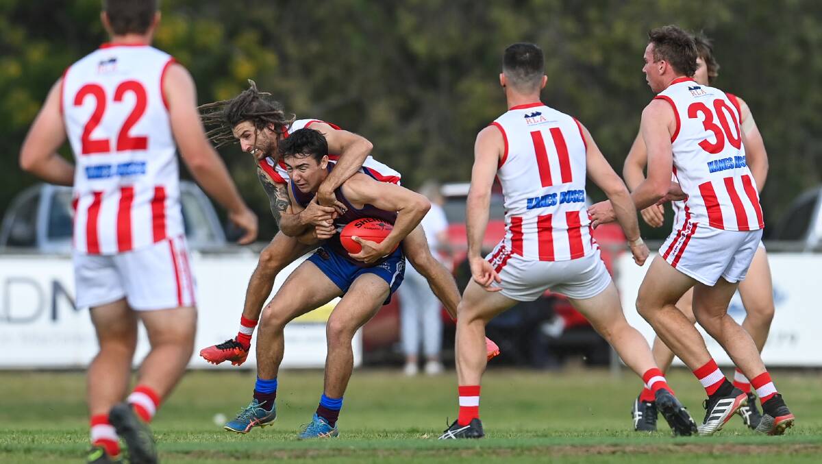 SWAMPED: Culcairn's Xavier Cannizzaro is surrounded by Swampies including the dreadlocked Aaaron Meyers who gets a piggyback.