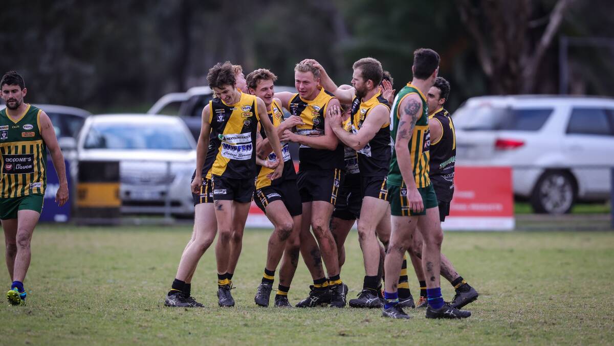 Barnawartha's Jackson Spiers is mobbed by team-mates after booting a goal.