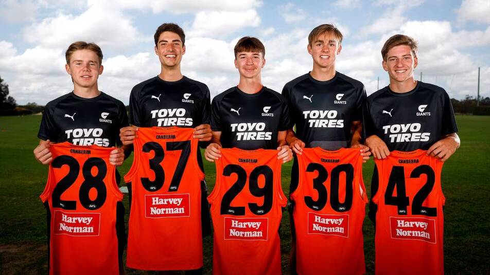 Giants draftees Harvey Thomas, Joe Fonti, Phoenix Gothard, James Leake and Nathan Wardius with their new jumpers on Monday. Picture by GWS Giants website