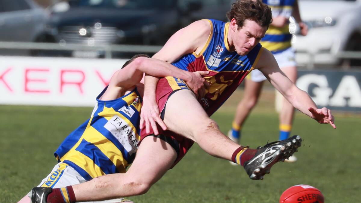 FINGERS CROSSED: Ganmain-Grong Grong-Matong's Jack McCaig gets a kick away under pressure earlier this year. Picture: DAILY ADVERTISER