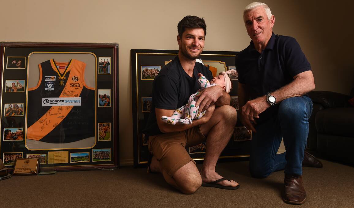 FAMILY: Joel Mackie with daughter Bowie, six weeks and father Rob. Picture: MARK JESSER