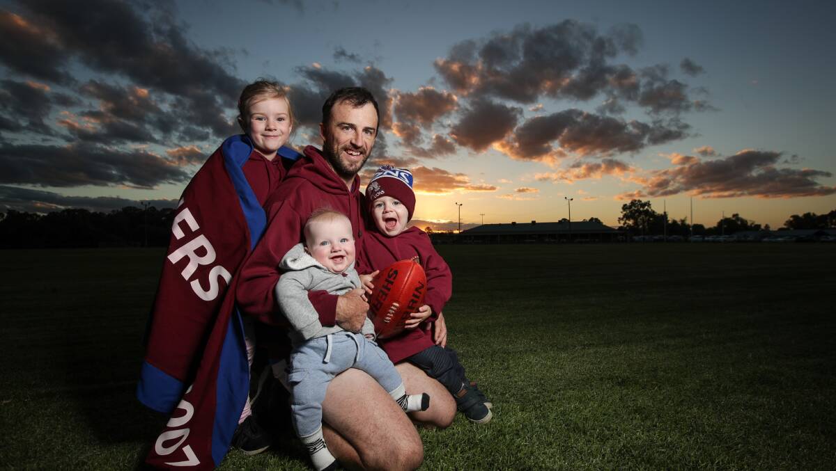 LION KING: Nat Stroh with his kids, Alice, 5, Elliot, 6 months and Toby, 2 ahead of his 200th match. Picture: JAMES WILTSHIRE