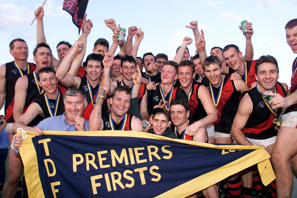 PREMIERS: Dederang-Mount Beauty players celebrate their 2001 flag triumph. The Bombers beat Barnawartha by 26-points.