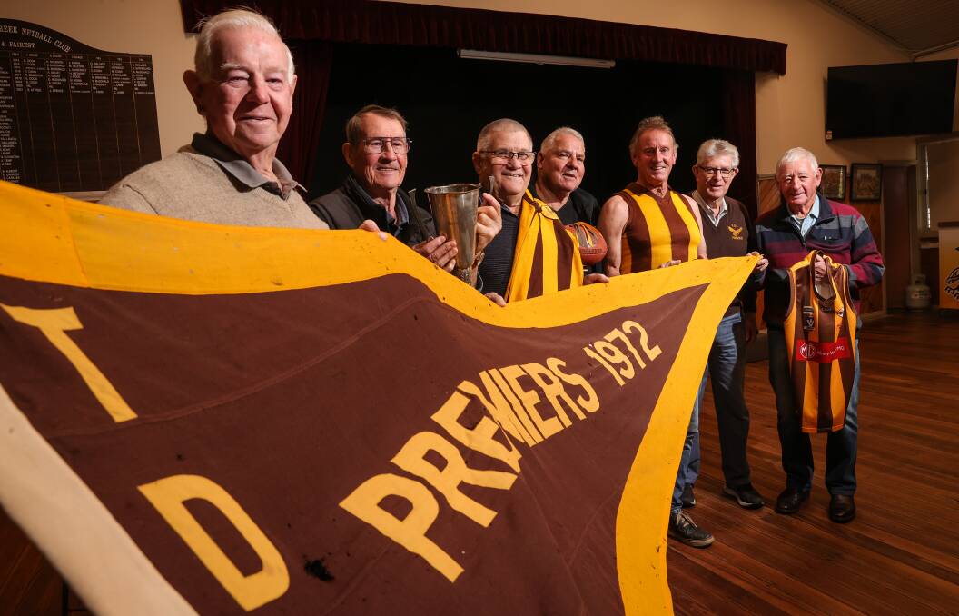 IT'S A GRAND OLD FLAG: Ray Rolfe, Bob Whitehead, David Sutherland, Paul Lonergan and Vin ONeill, Terry Barber and Ken Coulston with the 1972 flag.
