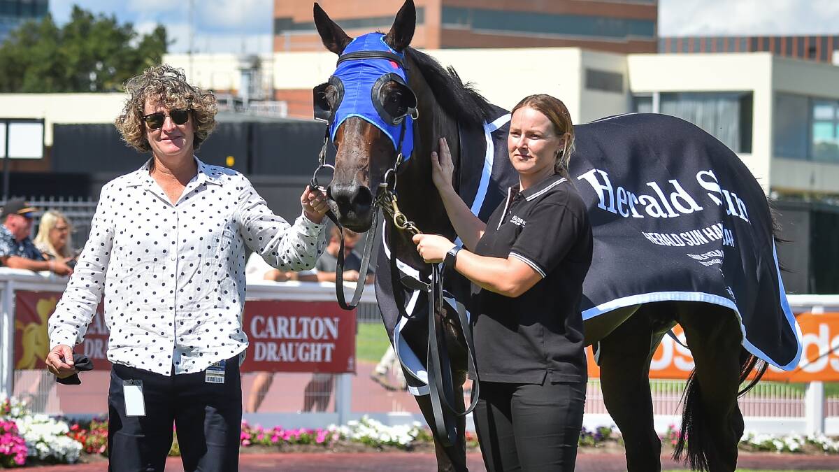 HUGE THRILL: Trainer Donna Scott with Takissacod in the mounting yard at Caulfield on Saturday after her mare scored a longshot victory with Blaike McDougall aboard. Picture: RACING PHOTOS
