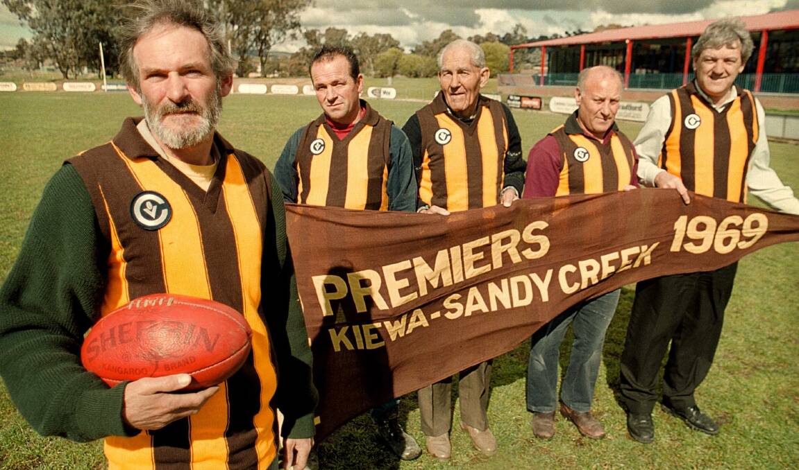 Some of the Hawks legends with the 1969 flag.