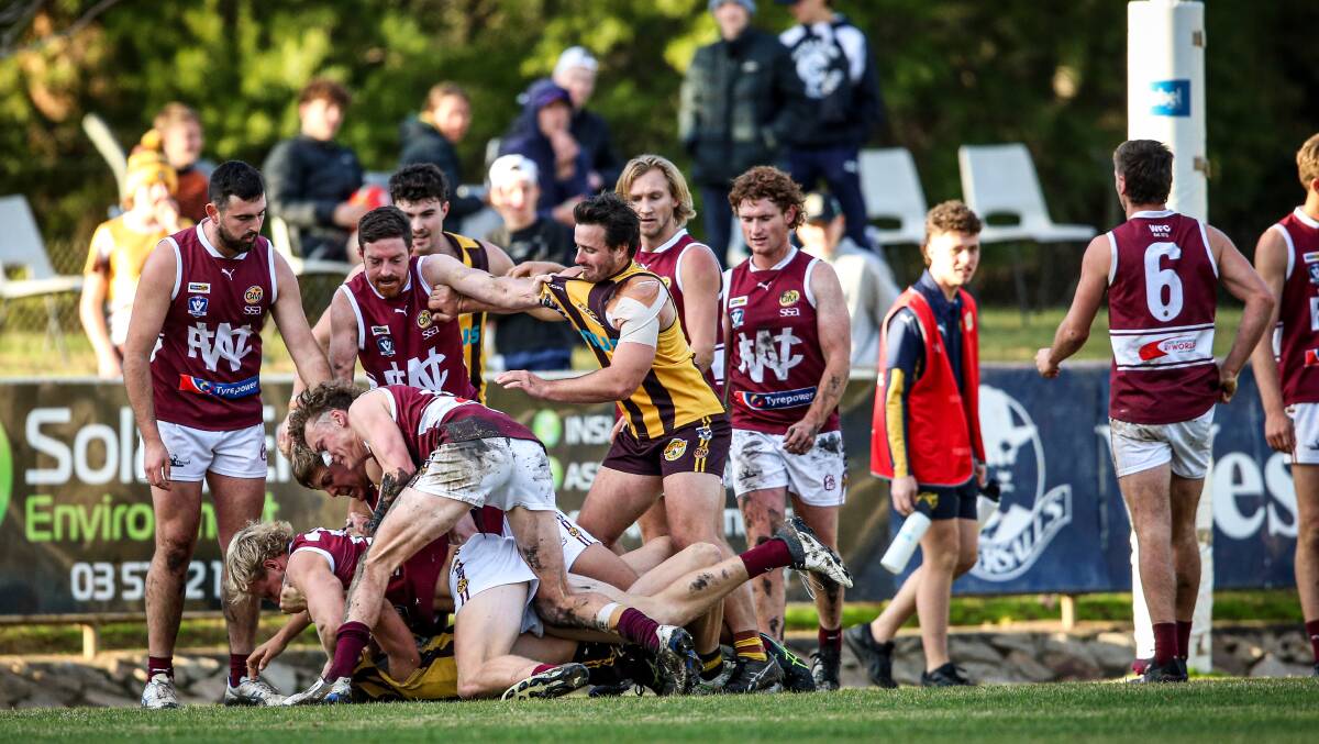 MELEE: Wodonga and Wangaratta Rovers players engage in a bit of push and shove during their clash at Martin Park on Saturday. Picture: JAMES WILTSHIRE