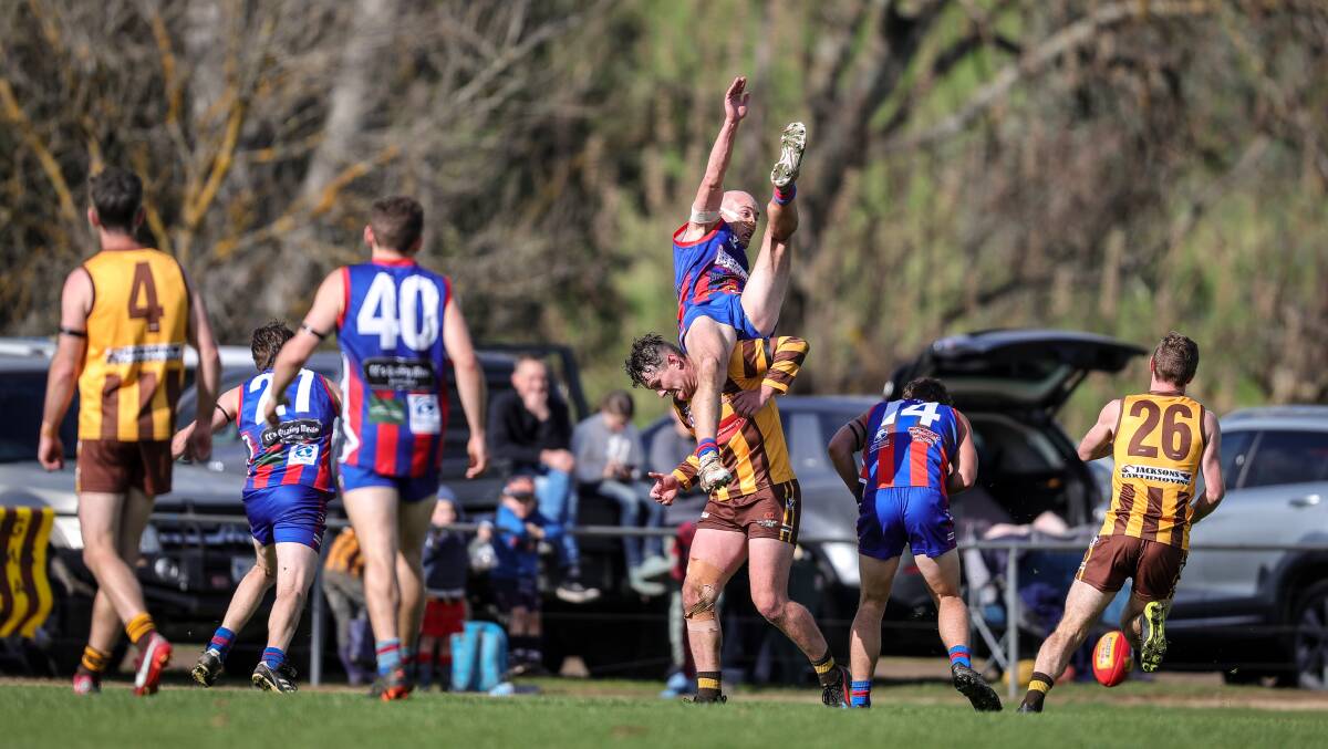 Beechworth's Kayde Surrey attempts a Mark of the Year contender over Connor Newnham. Pictures by James Wiltshire
