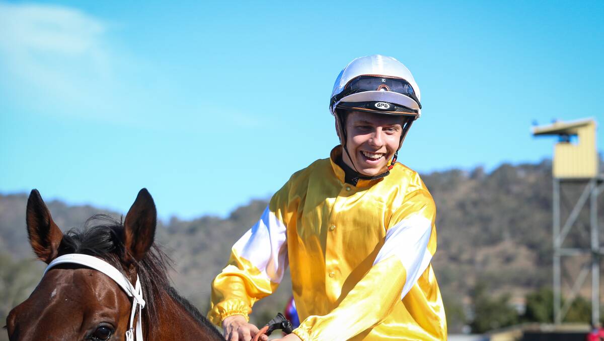 ALL SMILES: Jockey Logan McNeil returns to scale after victory aboard Lord Sundowner at Wodonga on Saturday. Picture: JAMES WILTSHIRE