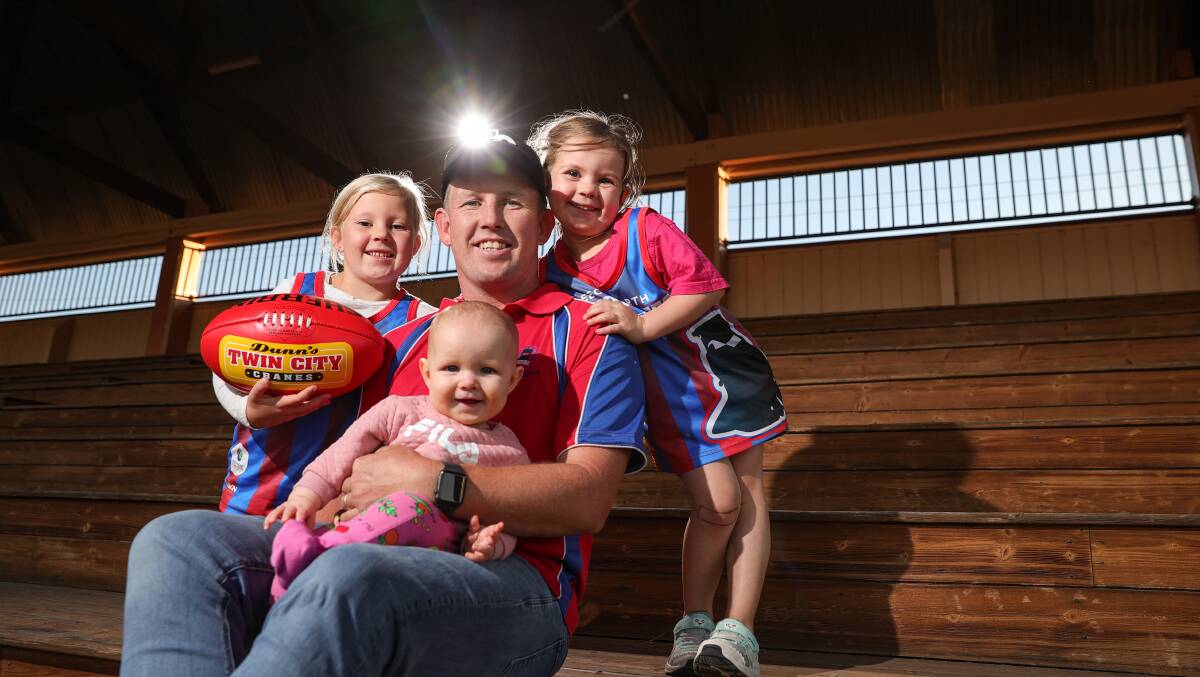 FAMILY MAN: Brayden Carey with his daughters Evie, 6, Zarhli, 4, and Ellie, 8 months. Picture: JAMES WILTSHIRE