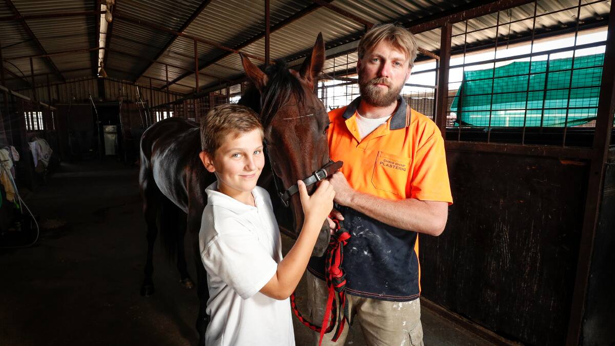 CUP CHANCE: Riley Chant, 12, with his father and trainer Chris and Glenferrie Duster who will be out to claim the Albury Pacers Cup. Picture: JAMES WILTSHIRE
