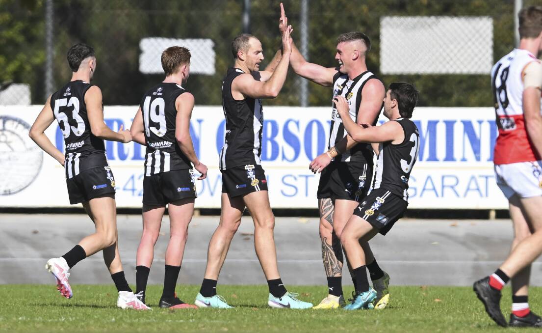 Wangaratta players celebrate a goal against Myrtleford where the Pies notched their first win of the season. Picture by Mark Jesser