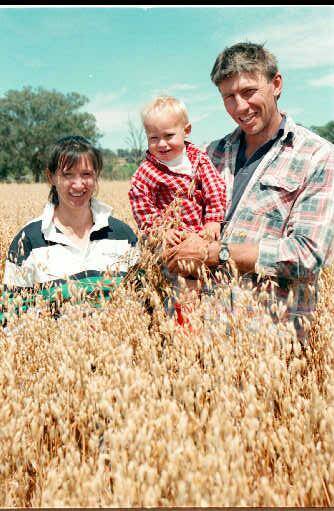 FLASHBACK: David Schilg with his wife, Natalie, and son on the family farm in 1996. Schilg is regarded as one of Burrumbuttock's greatest footballers and was a dual Azzi medal winner.