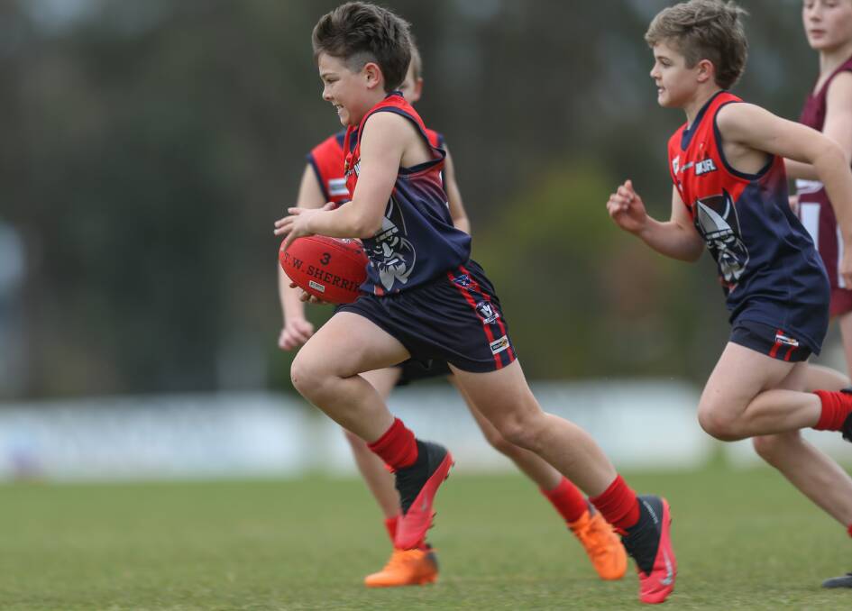ON THE BURST: Wodonga Raiders' Taj White charges forward for his side after finding plenty of space at Birallee Park on Sunday.