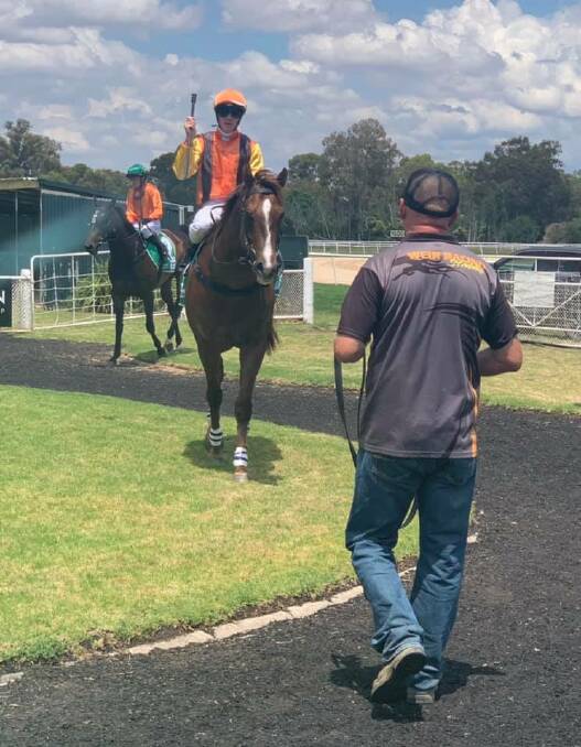 DOUBLE DELIGHT: Jockey John Kissick returns to scale aboard Cattledog Cod for trainer Kerry Weir at Corowa yesterday. Picture: WEIR RACING