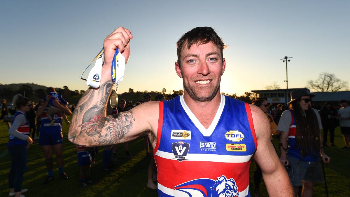 SILVERWARE: Josh Maher with his premiership medallion and best-on-ground medal.