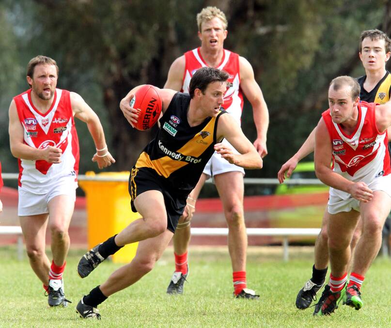 Andrew White in action in the 2012 decider.