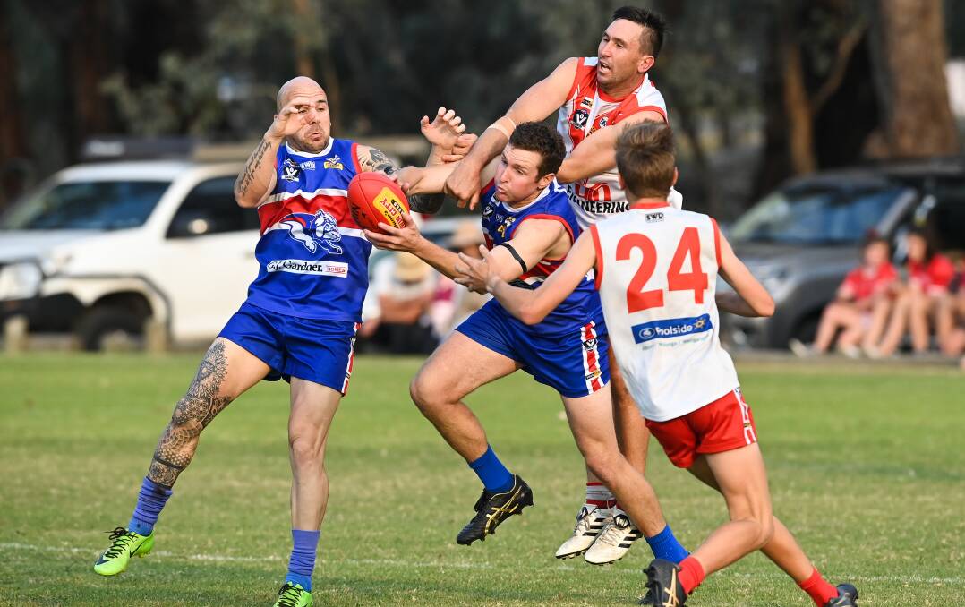CONTEST: Thurgoona's Daniel Kannenberg and James O'Connell clash with Chiltern's Mark Doolan on Saturday. Picture: MARK JESSER