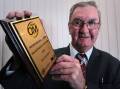 PROUD AS PUNCH: Pat Gleeson received the the Peter Bruhn Award for the Ovens and Murray Football-Netball League volunteer of the year in 2010. He sadly passed away earlier this week.