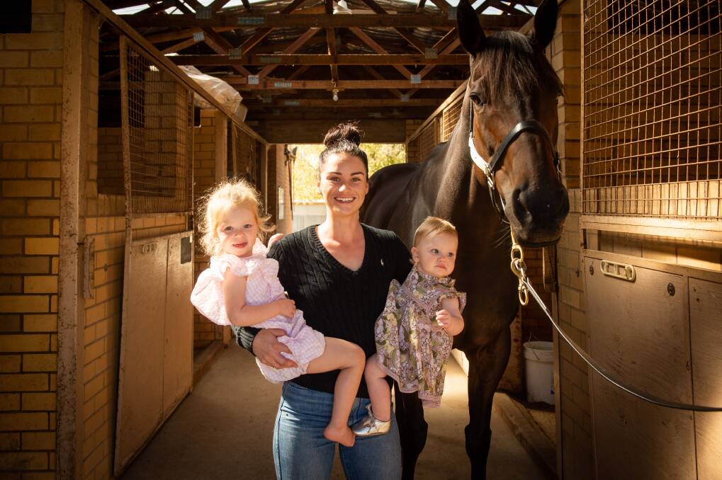 GIRL POWER: Danielle Scott with her two daughters Penelope, 3, and Maisie McDougall, 10 months and stable star Lord Von Costa. Picture: MARK JESSER