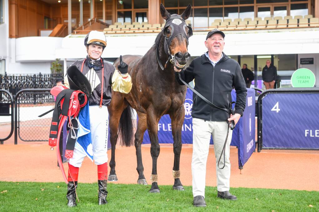 YOU BEAUTY: Craig Williams with Lord Von Costa and part-owner Rhys Holleran after they combined to win in listed company at Flemington in July. Picture: RACING PHOTOS