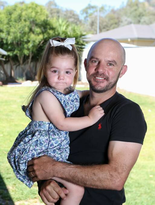 FAMILY MAN: Nick Souquet with his youngest daughter, Ivy, 3. The pair have temporarily located to Souquet's mum's home in Corowa.
