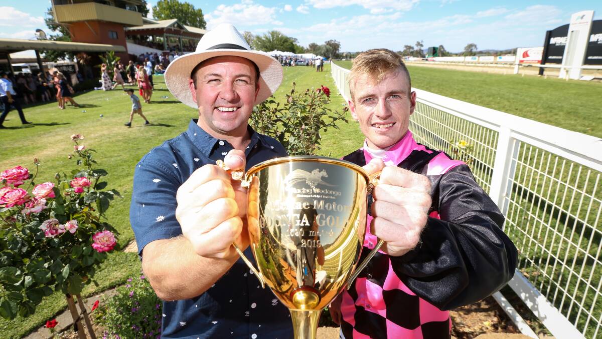 GOLDEN MOMENT: Trainer Craig Widdison and jockey Jarrod Fry
with the Wodonga Gold Cup. Picture: JAMES WILTSHIRE