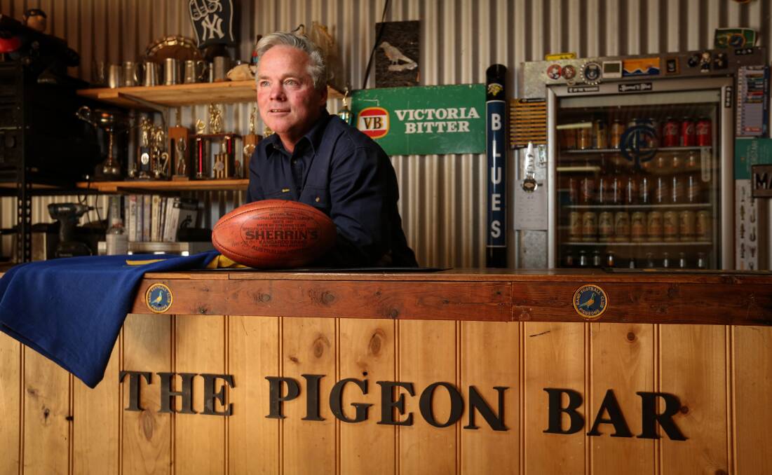Webster behind his Pigeon Bar.