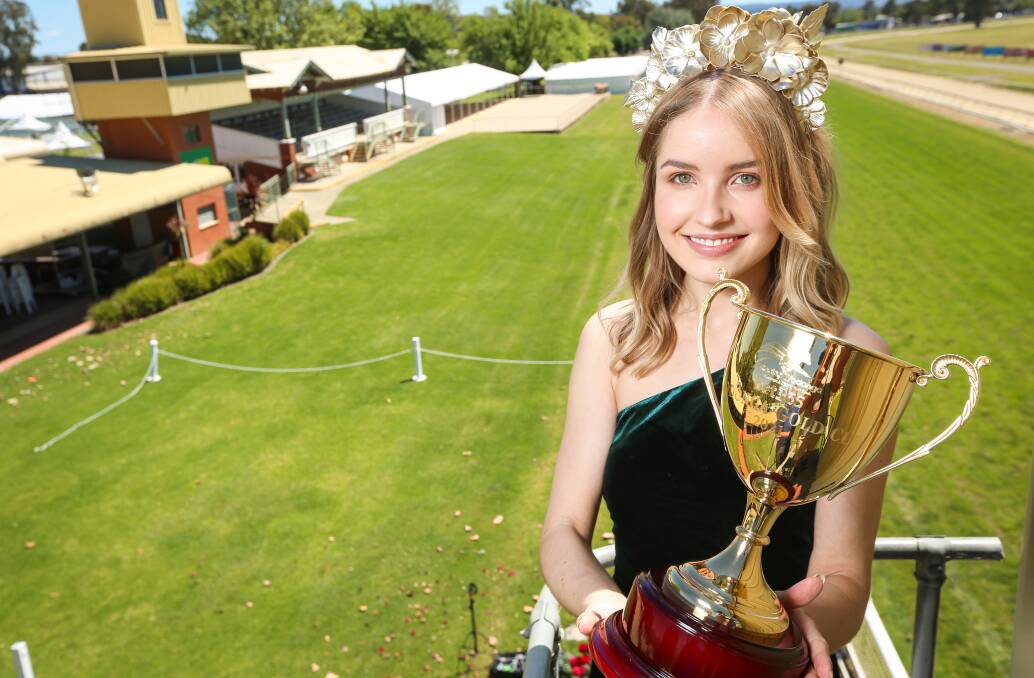 WEATHER WATCH: Isobel Stocks with the Wodonga Gold Cup on Monday in perfect weather conditions. Picture: JAMES WILTSHIRE