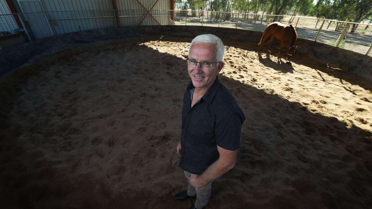 LIFE'S A BEACH: Andrew Dale with one of his gallopers at the Albury racetrack sand roll. Pictures: MARK JESSER