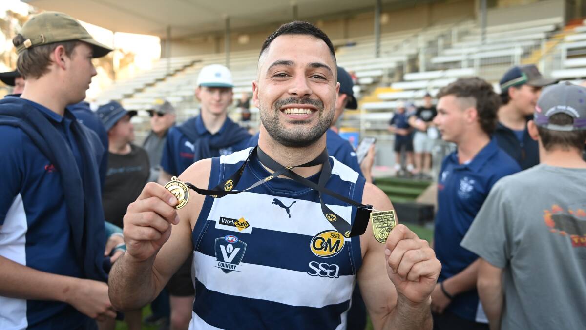 Yarrawonga star Michael Gibbons with the Did Simpson medal alongside his premiership medal. Picture by Mark Jesser