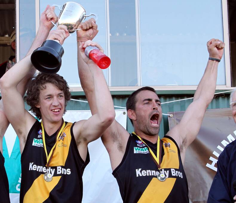 PREMIERS: Jamie Parr and Daniel McAlister hold the 2012 premiership cup aloft. Parr credits McAlister as having the biggest influence on his outstanding career.