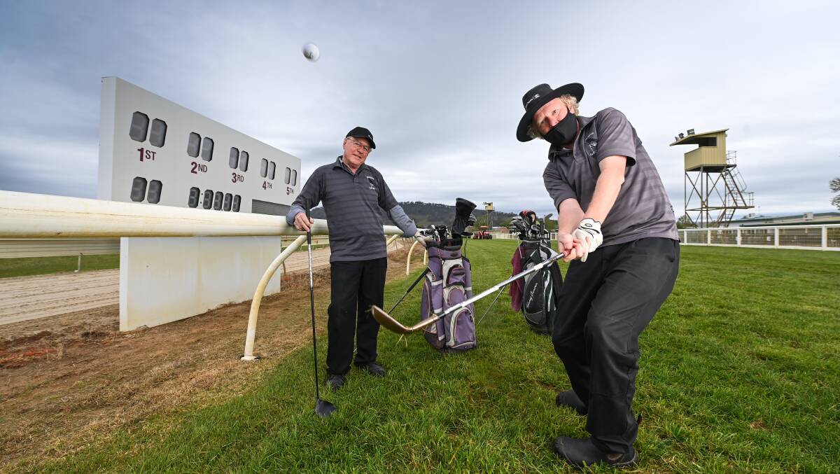 FREE HIT: Tallangatta Golf Club captain, Phil McLean and secretary, Brendon de Vries are eagerly anticipating The Hotham. Picture: MARK JESSER