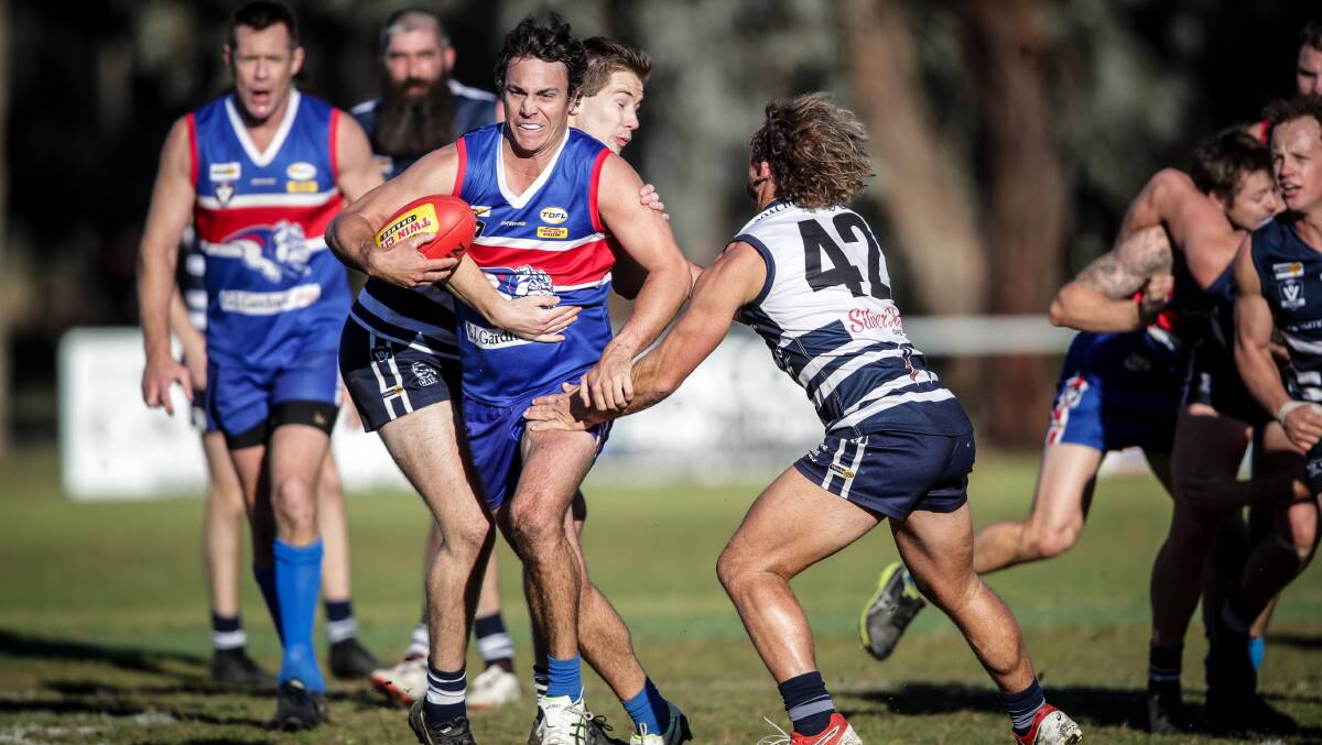 DASHING DOG: Thurgoona coach Brett Doswell tries to burst through a pack against Rutherglen on Saturday. Picture: JAMES WILTSHIRE