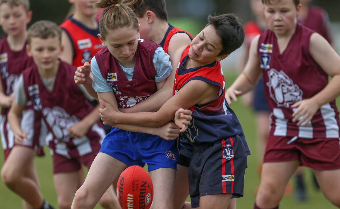 WRAPPED-UP: Wodonga's Miller Bedson is going nowhere after being collared by Wodonga's Brodie Lancaster in the under-12 practice match.