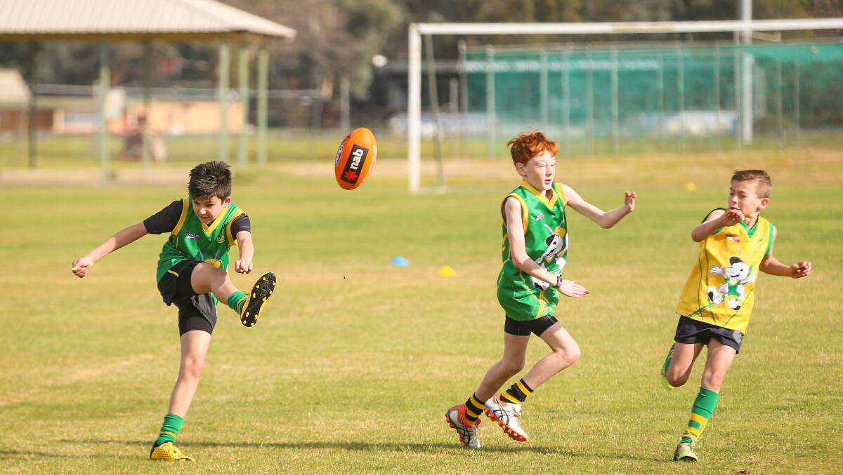 Charlie French boots the ball long in North Albury Auskick action over the weekend.