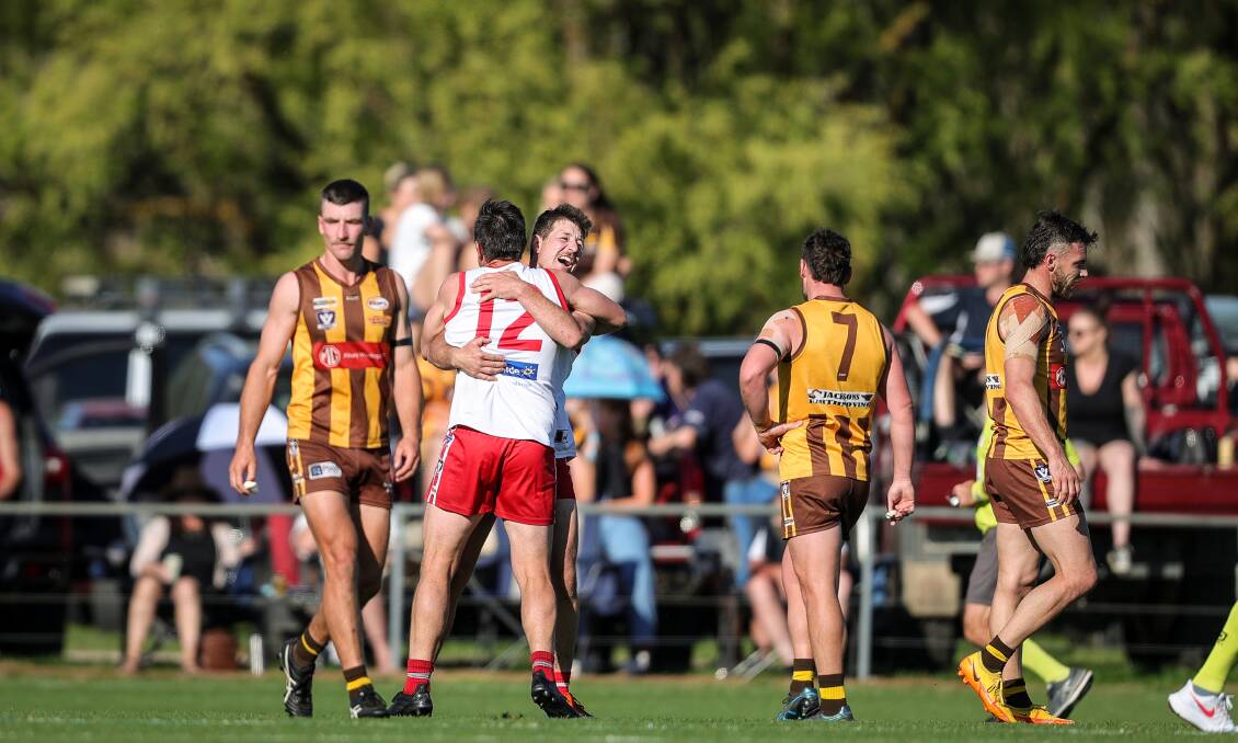 The Hawks defenders look deflated after Doolan kicked two of his five goals in the final term. 